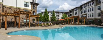 Resort-style Pool with covered seating at 4700 Colonnade Apartments in Birmingham, AL
